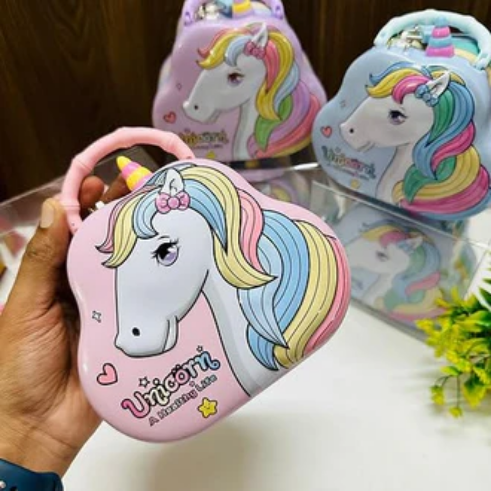Image of Unicorn Metal Piggy bank with Lock and Key in the pink holding in a hand