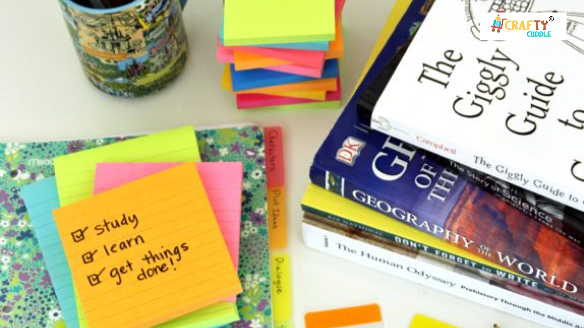 Image of sticky notes , notebooks and projects and different subjects book placed on the table.