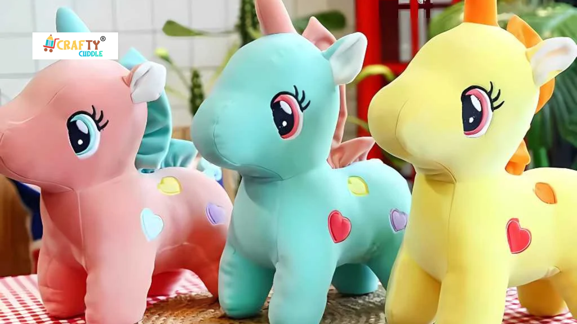 Image of three different unicorn themed soft toys.