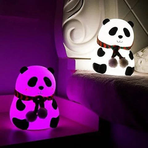 This image includes 2 panda's lamps and one placed on the side corner of the bed and other on the bed.