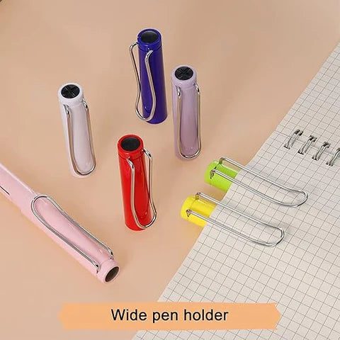 Photo of different colored wide pen holders on the paper.