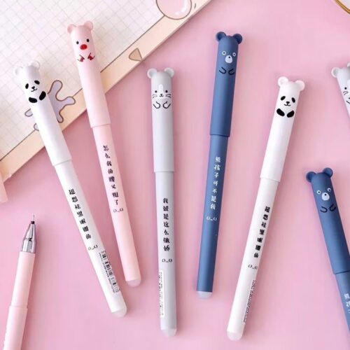 Set of pens with bear-shaped ends on a pink background