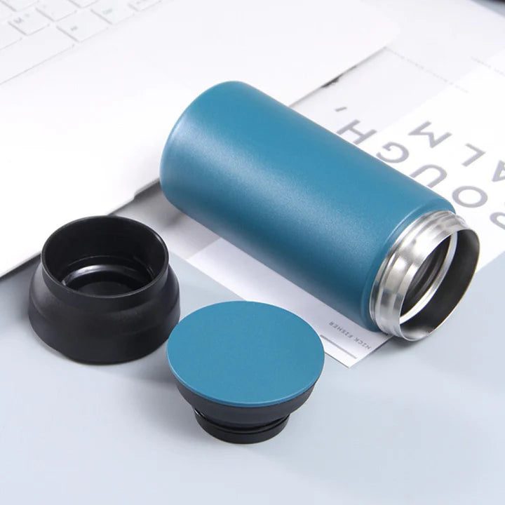 Image of opened blue color stainless steel water bottle.