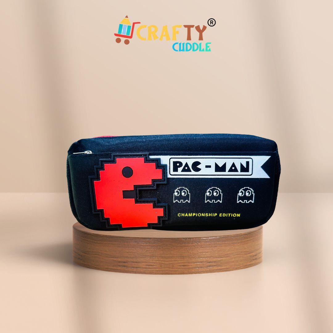 pac-man-championship-edition-pencil-pouch-retro-gamer-style-for-kidspac-man-pencil-pouchcrafty-cuddle-843794 Pac-Man themed black pencil pouch for kids featuring a red pixelated Pac-Man design and ghost icons, labeled "Championship Edition", displayed on a wooden platform with a peach background. Crafty Cuddle logo on top.