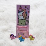 Pink Unicorn Magic pop-up pen stand with a vibrant unicorn design, built-in mirror, and password lock, ideal for organizing stationery in style.