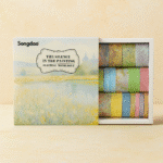 Packaged product with colorful tapes and 'Songda' branding on a beige background