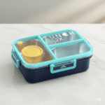 Dual Compartment Stainless Steel Lunch BoxStainless Steel Lunch BoxCRAFTY CUDDLEBlue and turquoise lunch box with compartments on a light surfaceBlueBackToSchoolBentoBox
