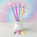 Colorful unicorn-themed pencils in a holder with a sparkly background