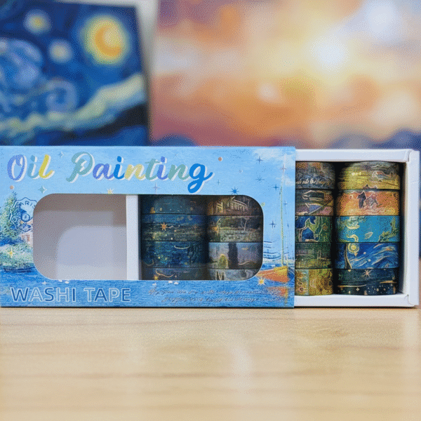 Box of oil painting washi tape with a blurred artwork in the background