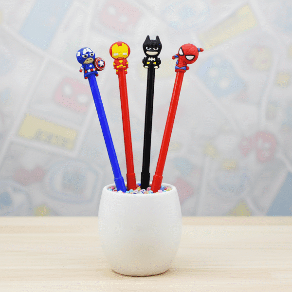 Four superhero-themed pens in a white holder with a colorful background