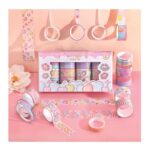 Set of colorful washi tape with packaging on a pink background