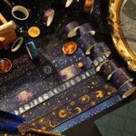 Washi Tape – 20 pcs Vast Universe SeriesCRAFTY CUDDLERolls of tape with celestial designs on a dark surface