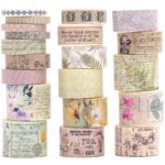 Washi Tape Box of 20 – Wilderness RemainsCRAFTY CUDDLEStacks of decorative washi tape with various designs and text on a white background