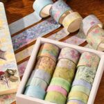 Washi Tape 20 Rolls – The Silence in the Painting SeriesCRAFTY CUDDLESet of colorful washi tape rolls in a box on a wooden surface