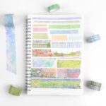 Washi Tape 20 Rolls – The Silence in the Painting SeriesCRAFTY CUDDLENotebook with colorful washi tape strips on a white background