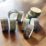 Washi Tape 20 Rolls – Oil Painting BlueCRAFTY CUDDLEDecorative tape rolls with gold and blue patterns on a wooden surface