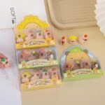 Capybara-themed rubber erasers in packaging on a light surface