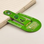 Green ruler with cartoon turtle design on a light background
