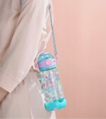 Mermaid-themed kids sipper bottle with strap and flip-top lid, 650 ml.