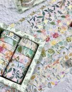 Set of floral-patterned boxes on a textured surface