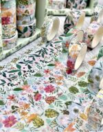 Floral-patterned tape rolls on a table