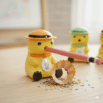 Cute Cartoon Manual Pencil SharpenerStationery > Erasers & SharpenersCRAFTY CUDDLEYellow duck - shaped pencil sharpener with a pink pencil, surrounded by colorful sprinkles on a light wooden surface.KidsStationery CuteStationery SchoolSupplies PencilSharpener CartoonStationery BackToSchool StationeryAddict StudyEssentials ReturnGifts StationeryLovers