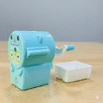 Cute Pastel Pencil Sharpener for KidsStationery > Erasers & SharpenersCRAFTY CUDDLEBlue cartoon - style pencil sharpener on a wooden surface with a light gray backgroundSky Blue