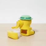 Cute Cartoon Manual Pencil SharpenerStationery > Erasers & SharpenersCRAFTY CUDDLEYellow and green toy sharpener on a beige surface with a white backgroundKidsStationery CuteStationery SchoolSupplies PencilSharpener CartoonStationery BackToSchool StationeryAddict StudyEssentials ReturnGifts StationeryLovers