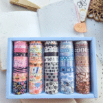 Multi - Design Washi Tape Set – 50 RollsDecorative Washi TapeCRAFTY CUDDLESet of colorful washi tape rolls in a box on a light background