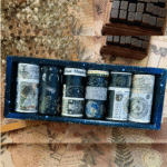 Set of washi tapes in a box with vintage-style paper in the background