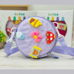 Kids Round Sling BagKids BagsCRAFTY CUDDLEChildren's purple bag with colorful patches on a light surfacePurpleKidsSlingBag CuteKidsFashion GirlsCrossbody MiniSlingBag KidsAccessories CartoonBag TrendyForKids BirthdayGiftIdeas ReturnGiftIdeas KidsStyle