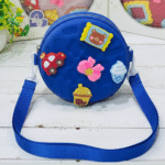 Kids Round Sling BagKids BagsCRAFTY CUDDLEBlue children's bag with colorful appliqués on a wooden surfaceBlueKidsSlingBag CuteKidsFashion GirlsCrossbody MiniSlingBag KidsAccessories CartoonBag TrendyForKids BirthdayGiftIdeas ReturnGiftIdeas KidsStyle