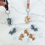 Tom & Jerry Cartoon Silicone KeychainKeychainsCRAFTY CUDDLECartoon character keychains on a marble surface2 (1 Tom & 1 Jerry)TomAndJerry CartoonKeychain CuteKeychain KeyringLove BagCharms AnimeAccessories KidsAccessories ReturnGiftIdeas TrendyKeychains GiftForKids