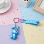 Cartoon Rabbit KeychainKeychainsCRAFTY CUDDLEBlue cartoon keychain with a matching wristband on a colorful surface1CuteKeychain BunnyKeychain CartoonKeyring KawaiiAccessories GirlsBagCharm BackpackCharm SiliconeKeychain RabbitKeychain ReturnGifts TrendyKeychains