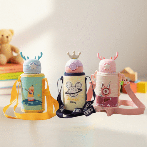 Three colorful water bottles with cartoon designs on a light background