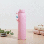 Leak Proof Mini Glass BottleCartoon Kids Water BottleCRAFTY CUDDLEPink water bottle with a decorative element on a light backgroundPink330mlBottle GlassWaterBottle MiniWaterBottle LeakProofBottle SiliconeSleeveBottle TravelWaterBottle OfficeWaterBottle ReusableBottle PastelBottle EcoFriendlyBottle