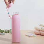 Leak Proof Mini Glass BottleCartoon Kids Water BottleCRAFTY CUDDLEPink water bottle with ribbed design on a light backgroundPink330mlBottle GlassWaterBottle MiniWaterBottle LeakProofBottle SiliconeSleeveBottle TravelWaterBottle OfficeWaterBottle ReusableBottle PastelBottle EcoFriendlyBottle