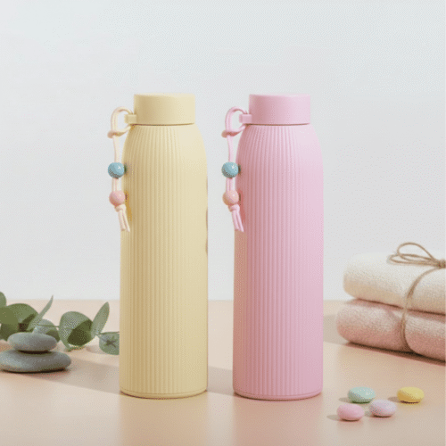 Two pastel-colored water bottles on a light background with decorative elements.