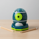 Space Rocket Manual Pencil SharpenerStationery > Erasers & SharpenersCRAFTY CUDDLEBlue and green pencil sharpener on a wooden surface with two pencils beside it.Blue & GreenKidsStationery CuteStationery KawaiiStationery SchoolSupplies StationeryAddict CartoonStationery BackToSchool StudyEssentials PastelStationery StationeryLove