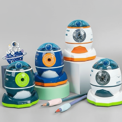 Set of robot-shaped pencil sharpeners on a gray background