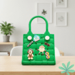 Waterproof EVA Handbag for GirlsKids BagsCRAFTY CUDDLEGreen children's handbag with cartoon character decorations on a wooden table.GreenKidsToteBag GirlsHandbag CuteKidsAccessories WaterproofBag CartoonBag MiniTote KidsFashion TrendyForKids GiftForGirls EverydayCarry
