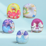 Five colorful backpacks with cartoon designs on a light blue background