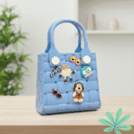 Waterproof EVA Handbag for GirlsKids BagsCRAFTY CUDDLEBlue toy handbag with decorative charms on a wooden surfaceBlueKidsToteBag GirlsHandbag CuteKidsAccessories WaterproofBag CartoonBag MiniTote KidsFashion TrendyForKids GiftForGirls EverydayCarry