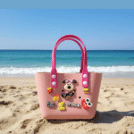 Cute Cartoon Charm Tote Bag for KidsKids BagsCRAFTY CUDDLEPink children's bag with cartoon character on a sandy beachPinkKidsToteBag BeachBag SummerAccessories CuteKidsStyle GirlsHandbag WaterproofBag CartoonBag TrendyKids VacationReady GiftForGirls