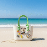 Cute Cartoon Charm Tote Bag for KidsKids BagsCRAFTY CUDDLEBeach bag with cartoon character and text on a sandy beach with ocean viewWhiteKidsToteBag BeachBag SummerAccessories CuteKidsStyle GirlsHandbag WaterproofBag CartoonBag TrendyKids VacationReady GiftForGirls