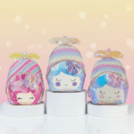 Three colorful character-themed bags on white cylindrical stands with a soft pink background