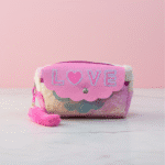 Cute LOVE Plush Pencil Pouch for GirlsPencil PouchCRAFTY CUDDLEPink pouch with 'LOVE' text on a light pink backgroundMulticolorCuteStationery PlushPouch GirlsAccessories PastelAesthetic SchoolEssentials KawaiiStyle TrendyKids BackToSchool PencilCaseLove GiftForGirls