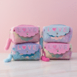 Four pastel-colored pouches with 'LOVE' text on a pink background
