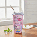 Baby Three Cartoon Printed Sipper TumblerSipper for kidsCRAFTY CUDDLEPink tumbler with cartoon character and 'Baby I'm Three' text on a wooden table.Pink RabbitKidsSipper CartoonBottle SteelSipper KidsWaterBottle CuteDrinkware InsulatedTumbler SchoolEssentials ReturnGiftIdeas KidsAccessories TrendyKidsProducts