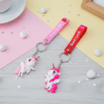 Unicorn Silicone KeychainKeychainsCRAFTY CUDDLETwo keychains with unicorn charms on a colorful background1UnicornKeychain CuteAccessories GirlsAccessories BagCharms UnicornLover ReturnGiftIdeas KidsFashion KawaiiStyle TrendyKeychains GiftForGirls